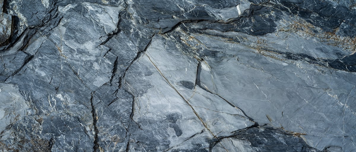 216 megapixels! A very high resolution texture photo of dark grey granite fractured stone textures; gigapixel image available to be licensed and downloaded as a digital file from VAST; photograph created by David Lineton.