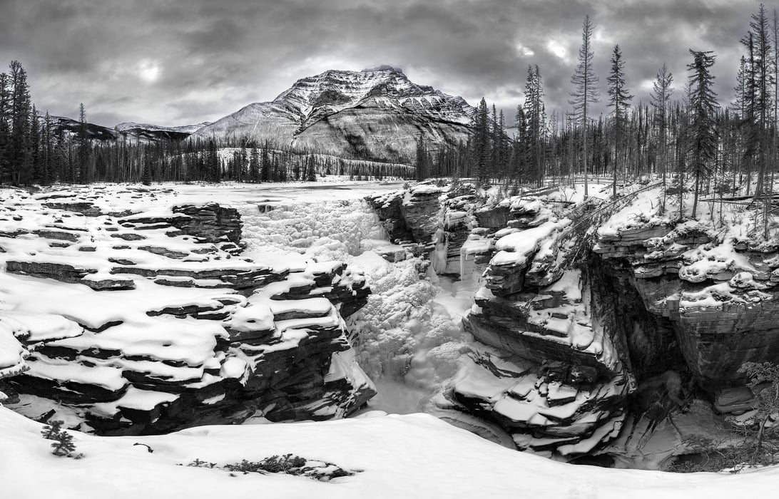 683 megapixels! A very high resolution, large-format, black & white photo print of a winter landscape with a frozen waterfall, a canyon, snow-covered ground, and a beautiful mountain; landscape photograph created by Scott Dimond in Jasper National Park, Alberta, Canada.